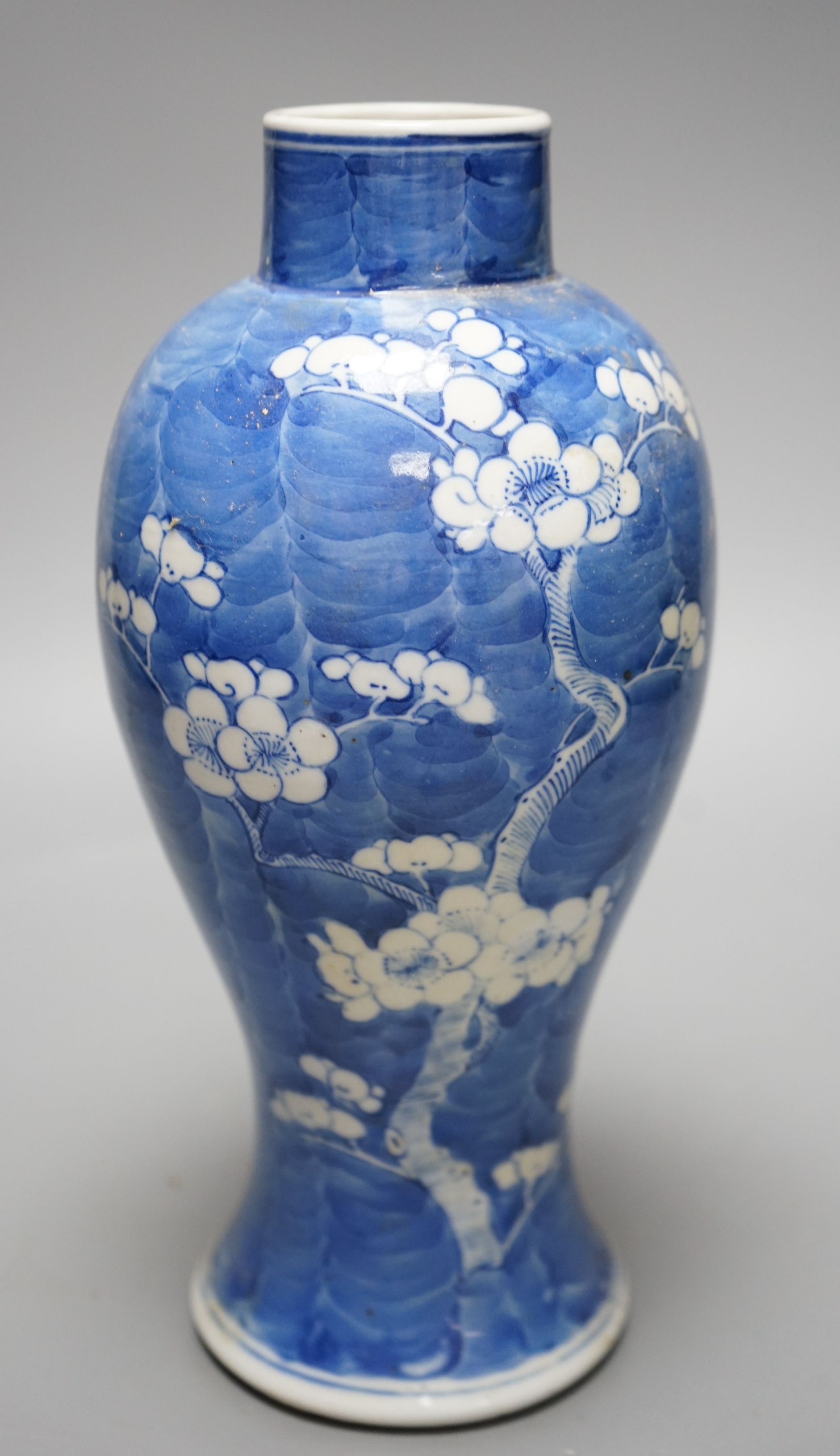 A late 19th century Chinese blue and white ‘prunus’ vase, 25cms high